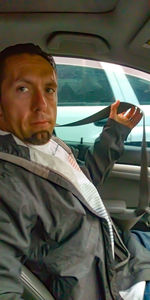 Portrait of young man in car