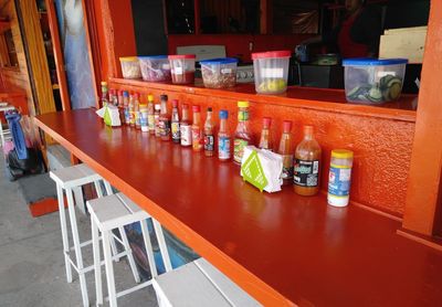 High angle view of bottles on table in restaurant