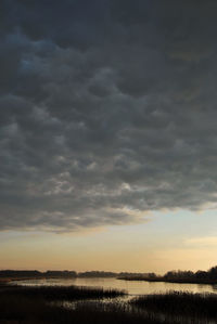 Scenic view of dramatic sky over lake