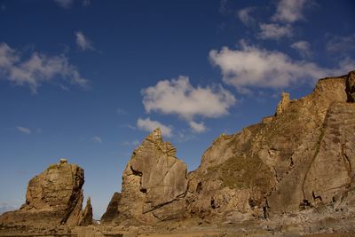 Rock formations on mountain against sky