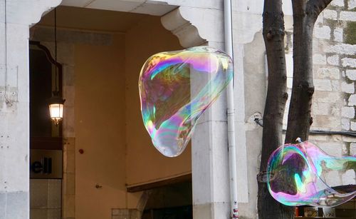 Bubbles flying against building