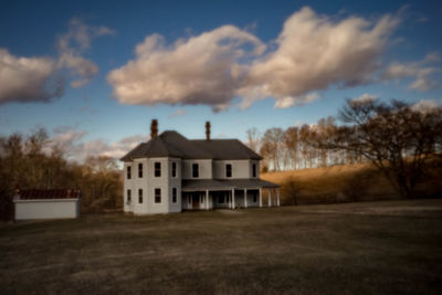 House on field against sky