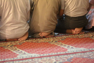 Low section of men praying