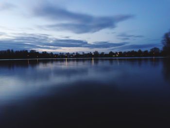 Reflection of trees in calm lake