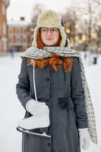 Portrait of young woman wearing hat