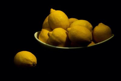 Close-up of fruit over black background