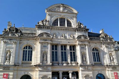 Low angle view of building against blue sky