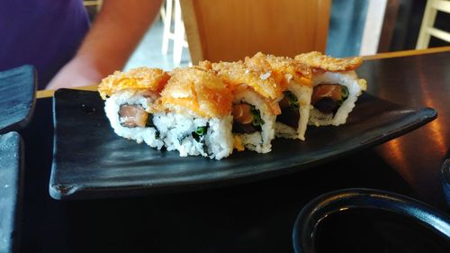 Close-up of sushi served on table