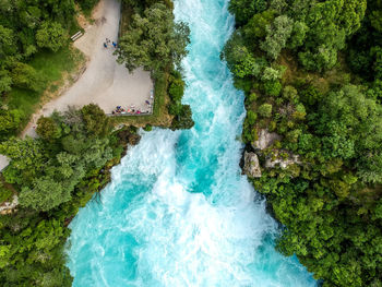 High angle view of waterfall amidst trees