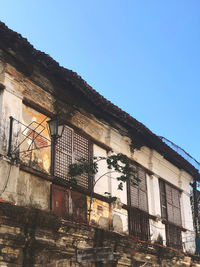 Low angle view of building against clear blue sky