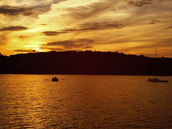 Scenic view of silhouette mountains against sky during sunset