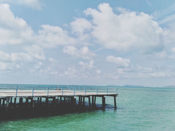 Pier over sea against sky