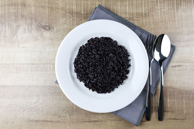 High angle view of coffee in plate on table