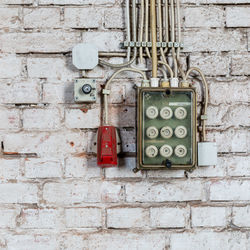 Close-up of telephone booth on wall