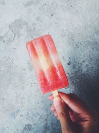 Close-up of hand holding ice cream cone