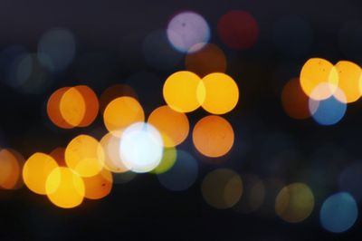 Defocused image of illuminated lights at night