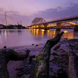 Binh loi bridge over river during sunset