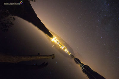 Scenic view of silhouette mountain against sky at night