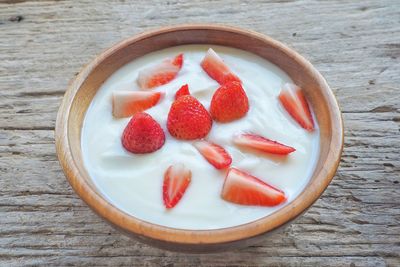 High angle view of chopped fruits in bowl on table
