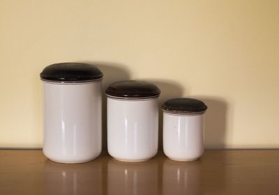 Close-up of containers on table