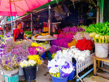 Various flowers for sale at market stall