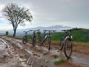 Bicycle on field against sky