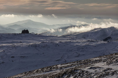 Scenic view of snowcapped mountains against sky