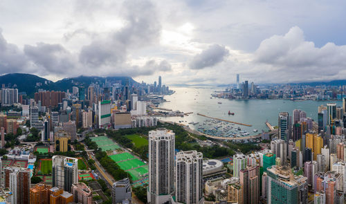 High angle view of city buildings against sky