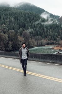 Portrait of man standing on road