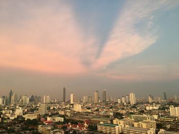 Cityscape against sky during sunset