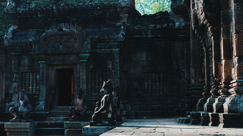 View of old statue against building