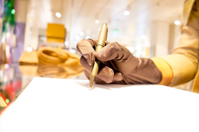 Close-up of man working on table