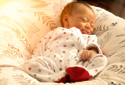 Cute baby sleeping on bed