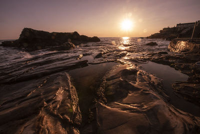 Panoramic view of sea against sky during sunset