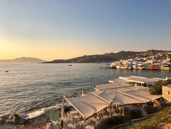 Scenic view of sea against clear sky during sunset