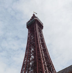 Low angle view of tower against cloudy sky