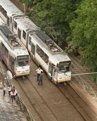 High angle view of train on railroad tracks in city