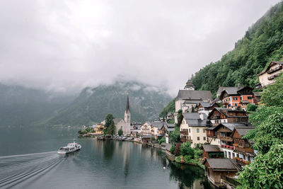 Panoramic view of buildings and mountains against sky