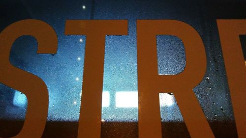 Close-up of text on wall