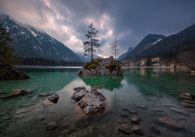 Scenic view of lake in the german alps with dramatic sky.