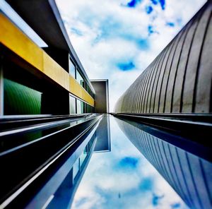 Low angle view of building against cloudy sky