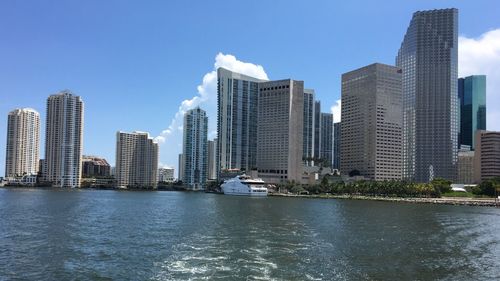 Sea and buildings against sky