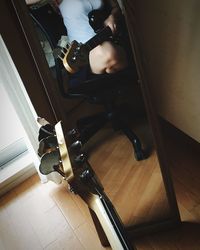 Low section of woman sitting on floor