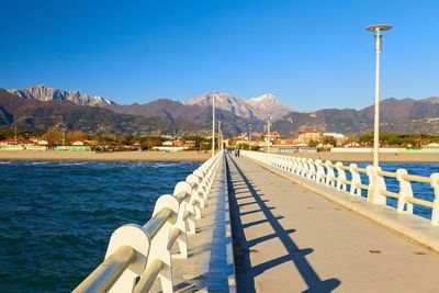 Scenic view of mountains against clear blue sky