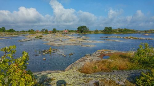 Scenic view of sea against cloudy sky