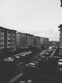 High angle view of traffic on road against buildings