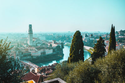 Blue hours in verona centre, italy. panoramic view from above on adige river and ponte pietra bridge