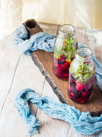 High angle view of fruits in glass jar on table