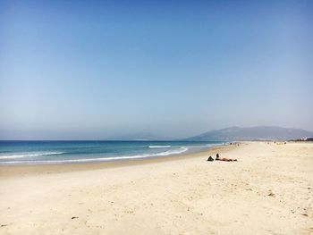 Scenic view of beach against clear sky