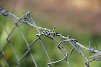 Close-up of barbed wire fence